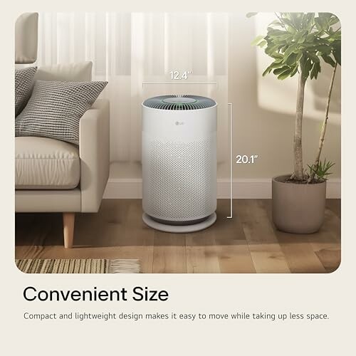 Compact air purifier beside a couch and plant in living room.