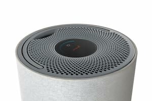 Top view of a cylindrical air purifier with a modern design.