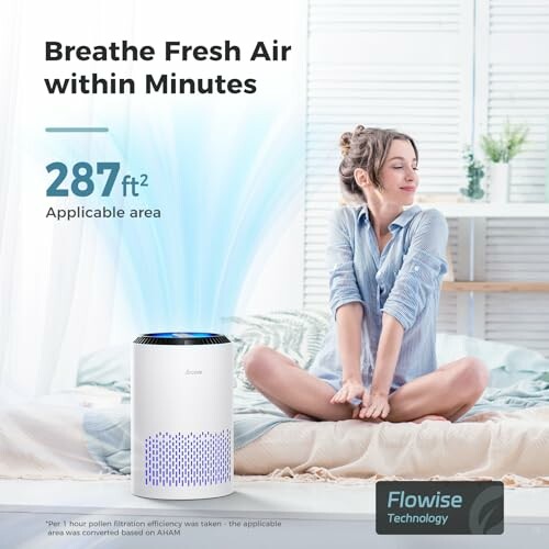 Woman relaxing on bed with Flowise air purifier nearby.